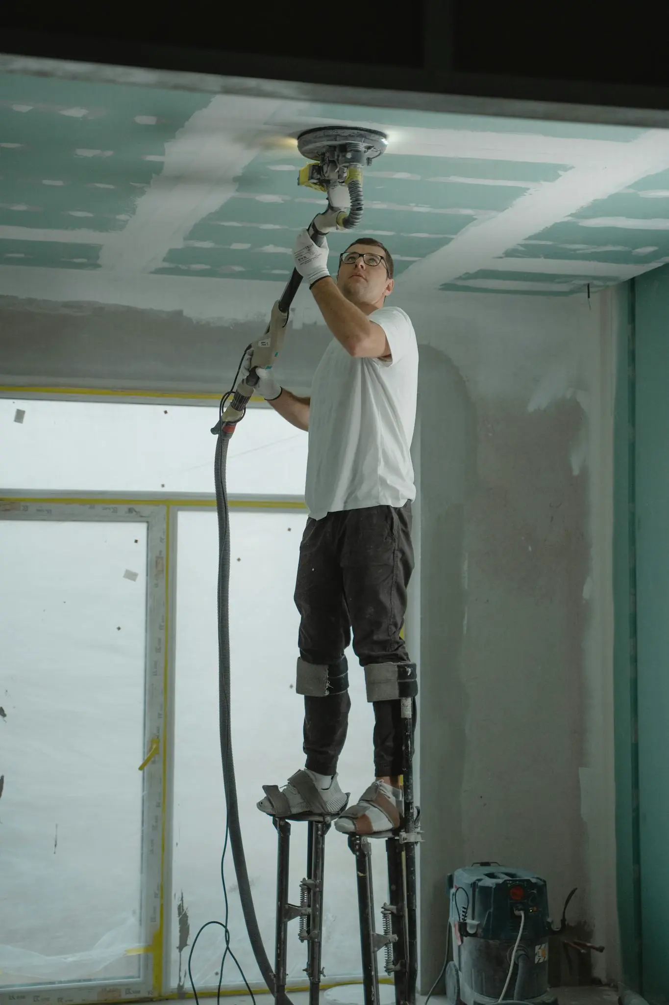 Upper-level framing and ceiling finish work for an attic conversion
