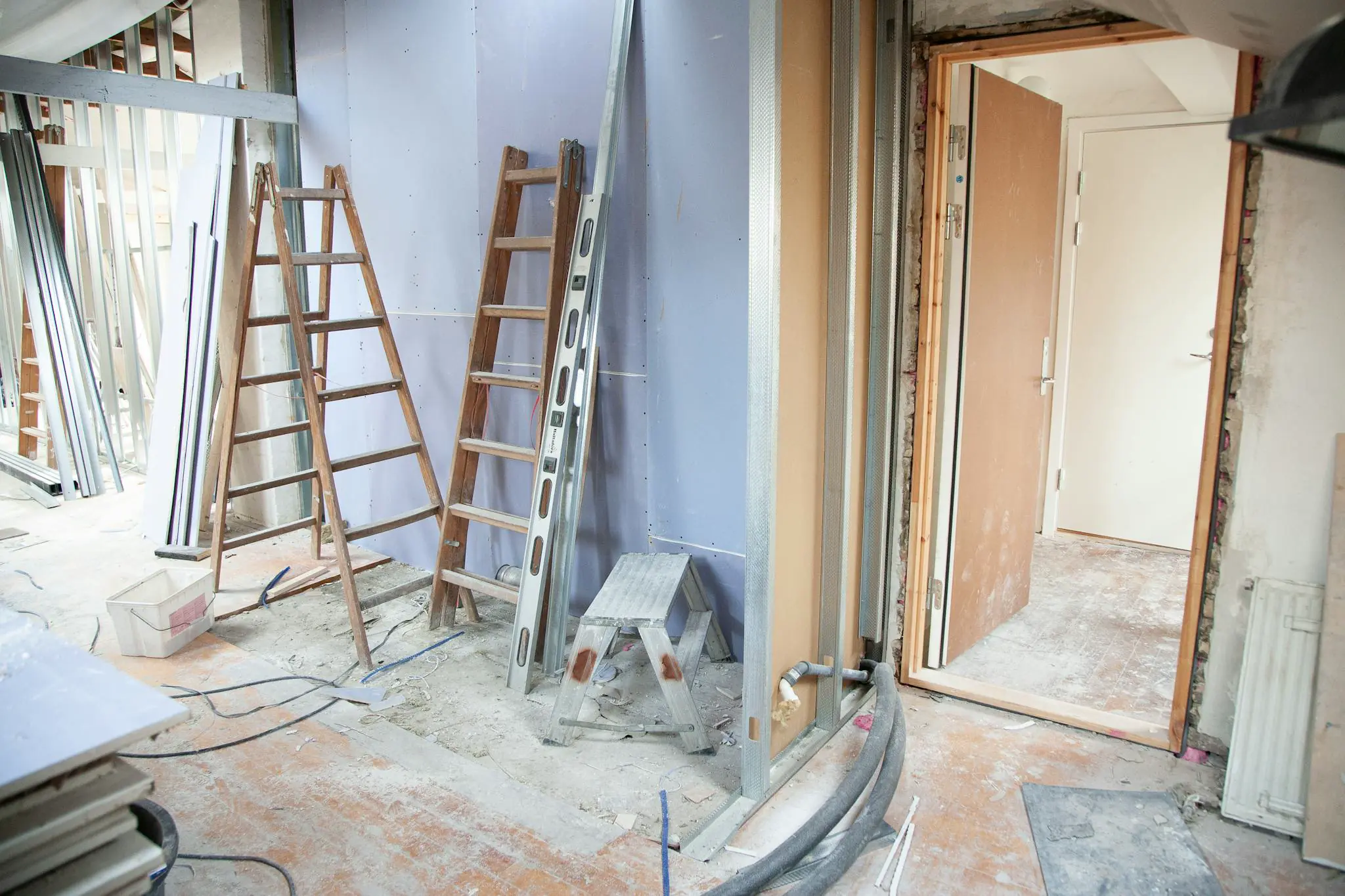 Home addition framing and structural coordination on a residential job site